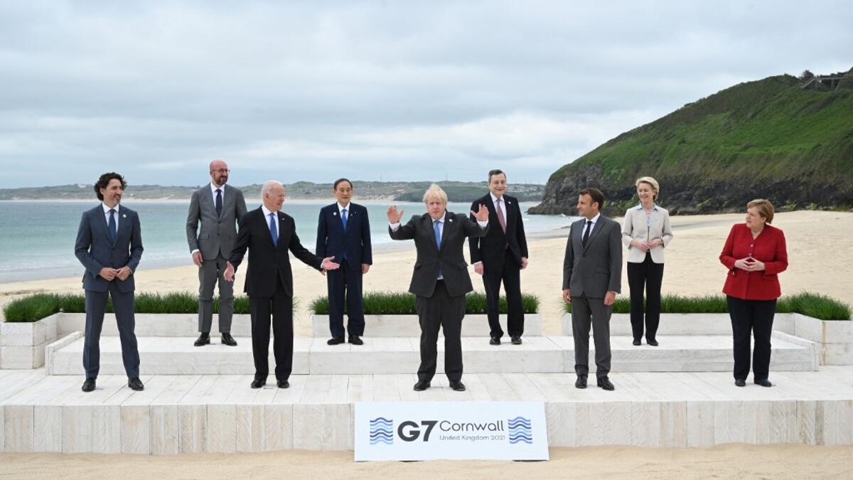L-R) Canada's Prime Minister Justin Trudeau, President of the European Council Charles Michel, US President Joe Biden, Japan's Prime Minister Yoshihide Suga, Britain's Prime Minister Boris Johnson, Italy's Prime minister Mario Draghi, France's President Emmanuel Macron, President of the European Commission Ursula von der Leyen and Germany's Chancellor Angela Merkel pose for the family photo at the start of the G7 summit in Carbis Bay, Cornwall on June 11, 2021. G7 leaders from Canada, France, Germany, Italy