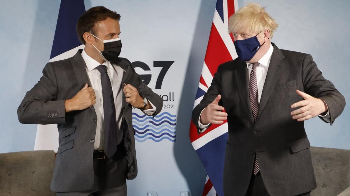 Britain's Prime Minister Boris Johnson and France's President Emmanuel Macron take part in a bilateral meeting during the G7 summit in Carbis bay