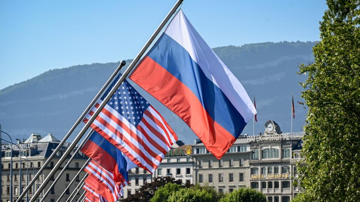 Russians and US flags are seen on the Mont-Blanc bridge on June 16, 2021 in Geneva ahead of the summit between Russian leader and US President