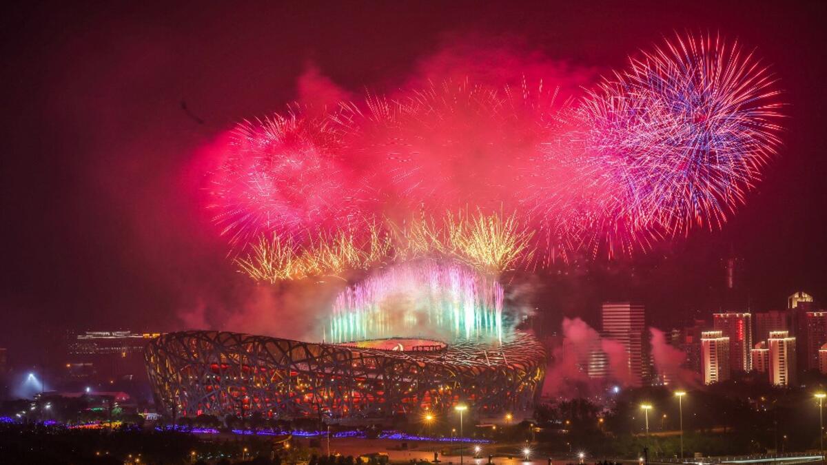 This photo shows fireworks exploding during an art performance held at the Bird's Nest national stadium to mark the upcoming 100th anniversary of the founding of the Chinese Communist Party, in Beijing. STR / AFP