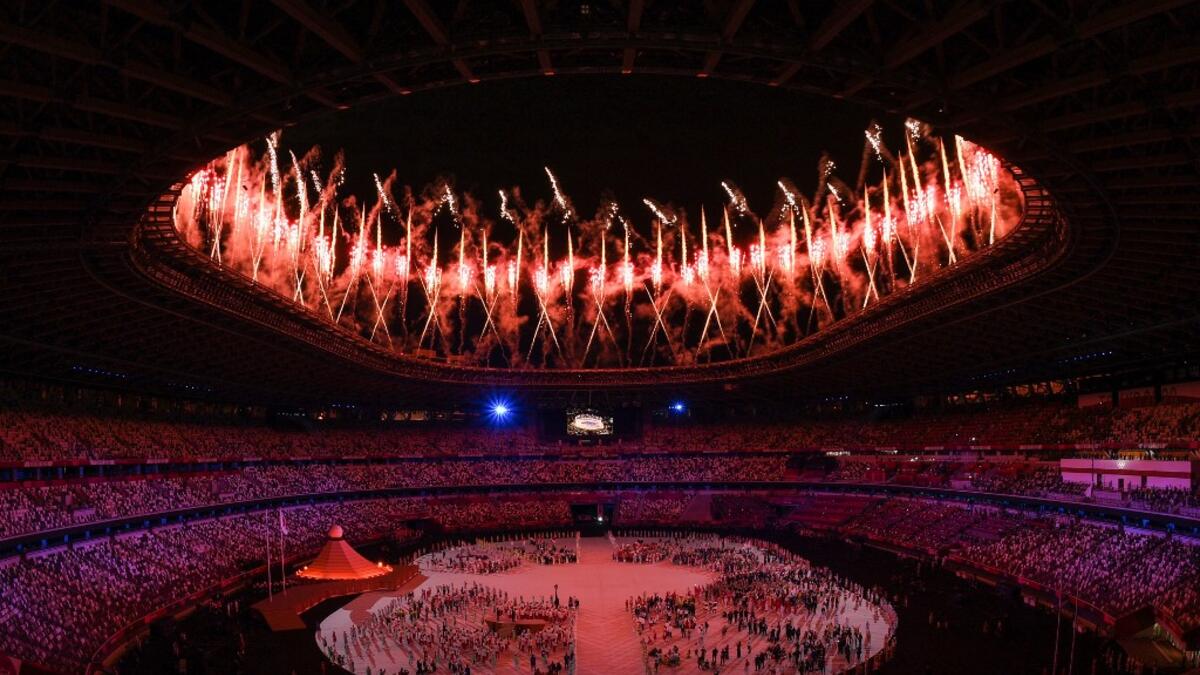 Fireworks go off around the Olympic Stadium during the opening ceremony of the Tokyo 2020 Olympic Games, in Tokyo