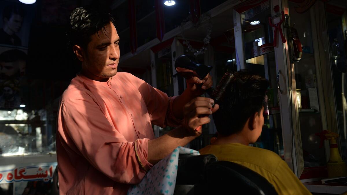 Since the Taliban swept to power in mid-August, Afghans have little cash to spare and fear being punished for sporting short or fashionable cuts.