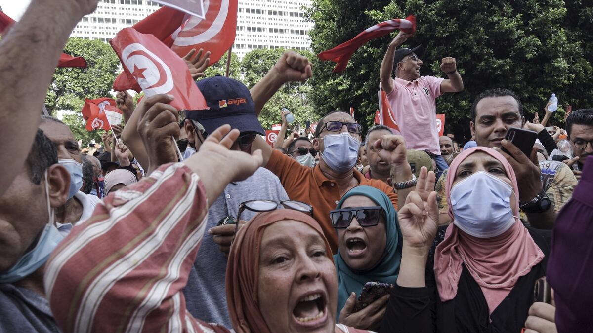 Demonstrators chant slogans during a protest in Tunisia's capital Tunis on September 26, 2021, against President Kais Saied's recent steps to tighten his grip on power.