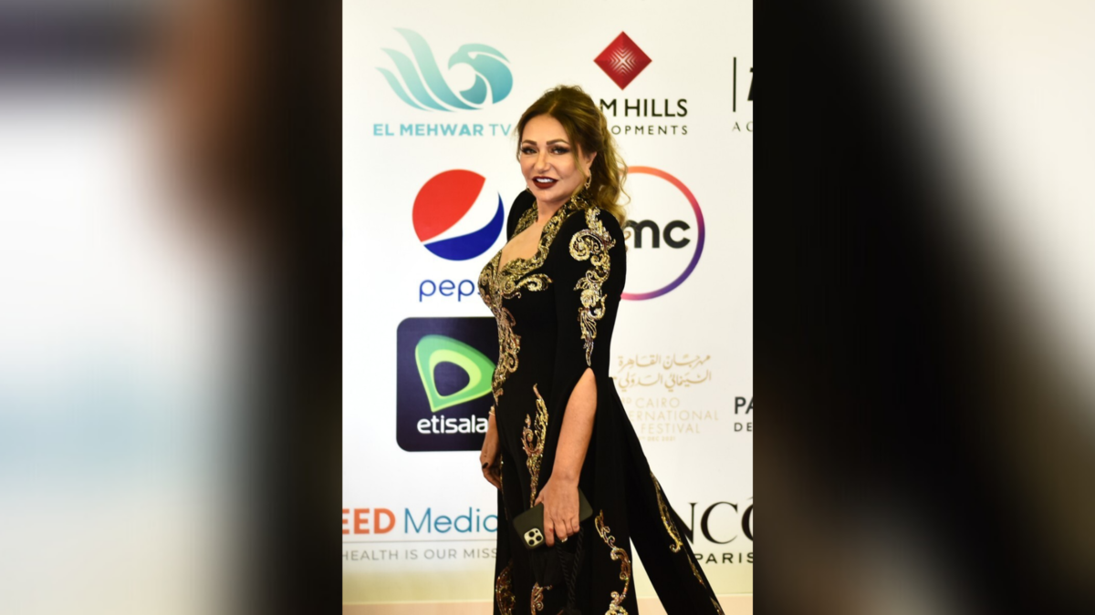 Egyptian actress Laila Elwi poses on the red carpet during the opening of the 43rd edition of the Cairo International Film Festival (CIFF) at the Cairo Opera House in the Egyptian capital on November 26, 2021. (Photo by Sayed HASAN / AFP)