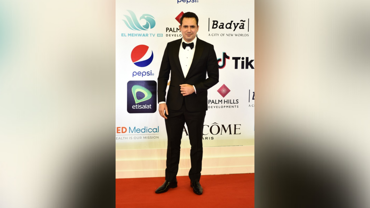 Tunisian actor and former footballer Dhafer L'Abidine poses on the red carpet during the opening of the 43rd edition of the Cairo International Film Festival (CIFF) at the Cairo Opera House in the Egyptian capital on November 26, 2021. (Photo by Sayed HASAN / AFP)