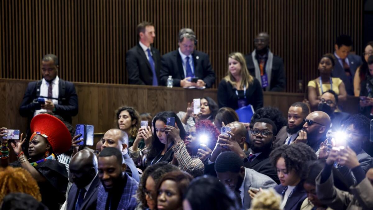 Attendees listen as U.S. Vice President Kamala Harris gives remarks