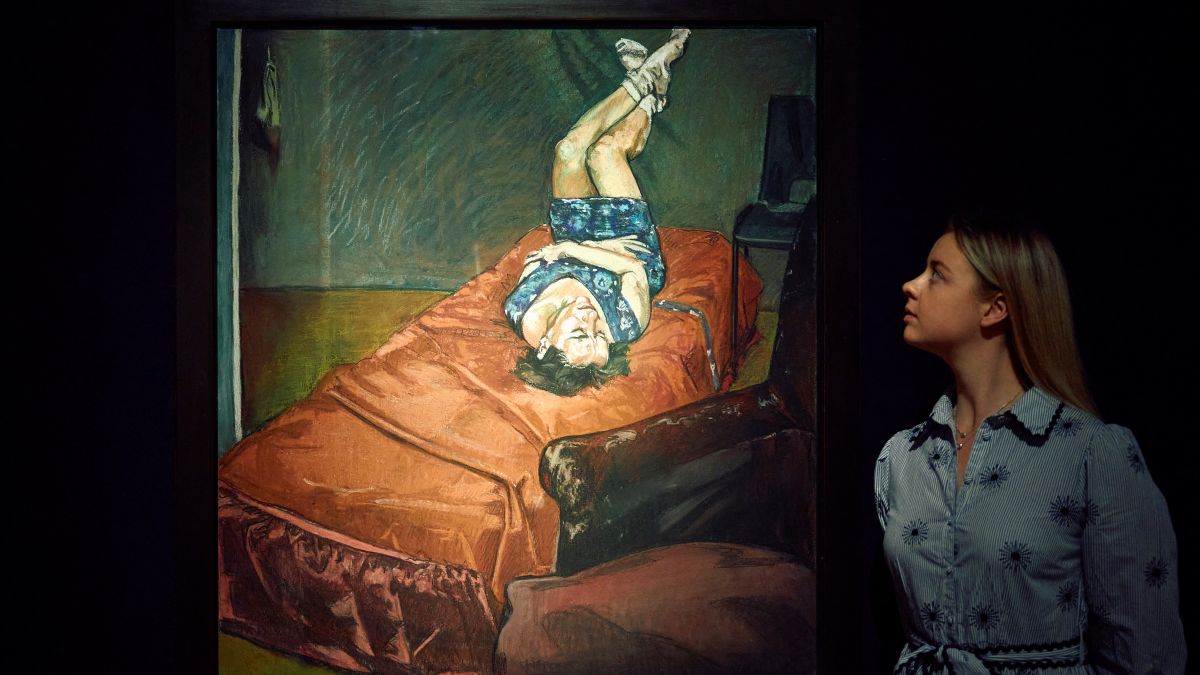 staff member looks at a painting by Paula Rego 'Untitled No. 7', estimate: £1,200,000 1,800,000 during a photocall at Christie's auction house ahead of the 20th/21st Century Evening Sale in London (.photo by afp)