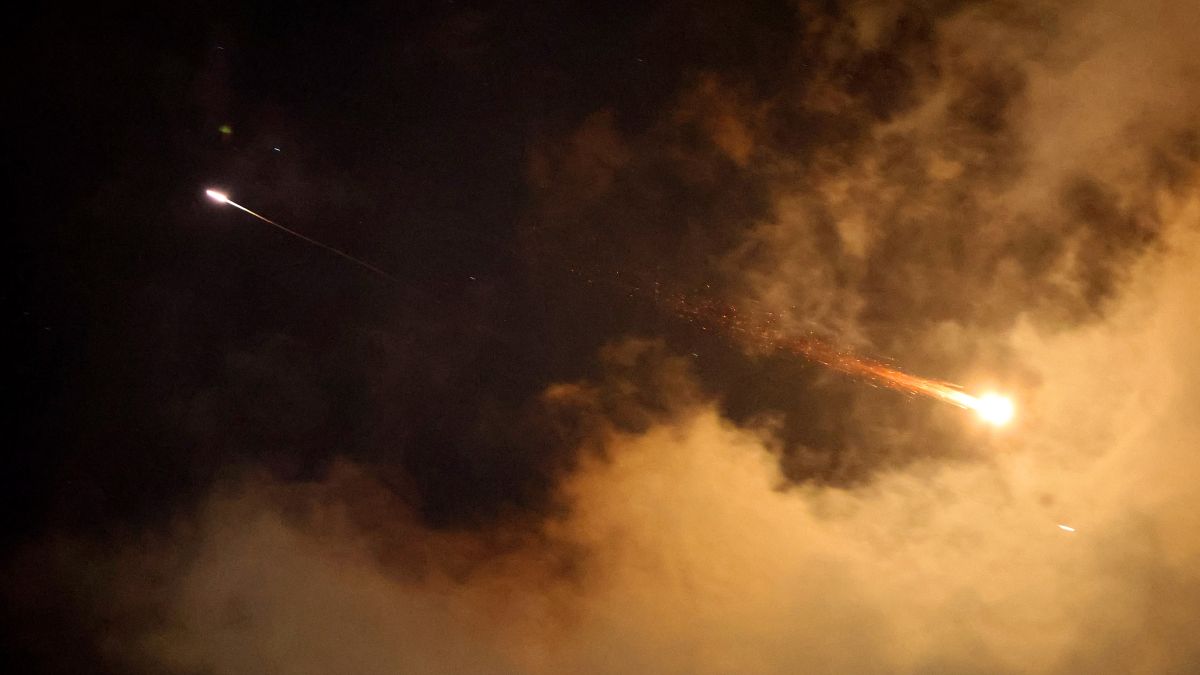 Rocket trails are seen in the sky above the Israeli coastal city of Netanya amid a fresh barrage of Iranian missile attacks on June 21, 2025. Israel's war with Iran entered its second week with the Israeli military chief warning of a "prolonged campaign" and Tehran ruling out further nuclear talks with the United States until Israel halts its attacks. (Photo by JACK GUEZ / AFP) Revealed: The IRGC commander orchestrating global attacks on Israeli targets