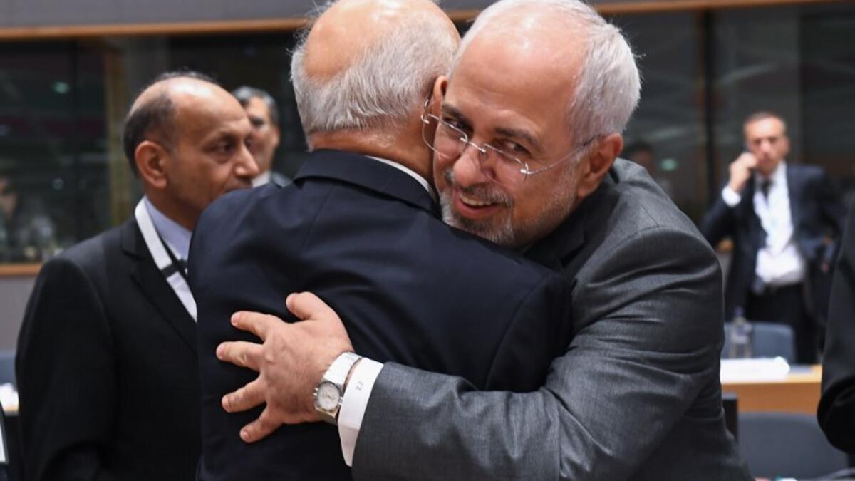 Iran's Foreign Minister Mohammad Javad Zarif (R) and Iraq's FM Ibrahim Al-Jaafari attend a conference on "Supporting the future of Syria and the region" at the European Council in Brussels on April 25, 2018. 
Emmanuel Dunad / AFP