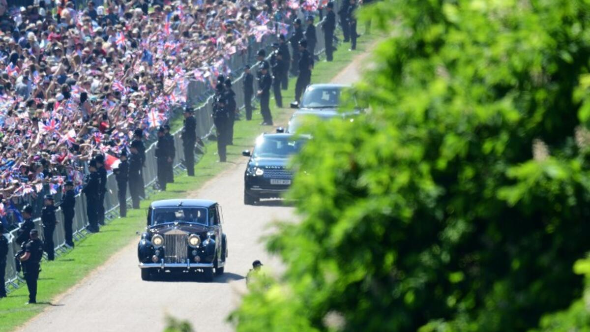 Meghan Markle and her mother, Doria Ragland, are driven along the Long Walk as they arrive for her wedding ceremony to marry Britain's Prince Harry, Duke of Sussex, at St George's Chapel, Windsor Castle, in Windsor, on May 19, 2018. 
Emmanuel DUNAND/ AFP