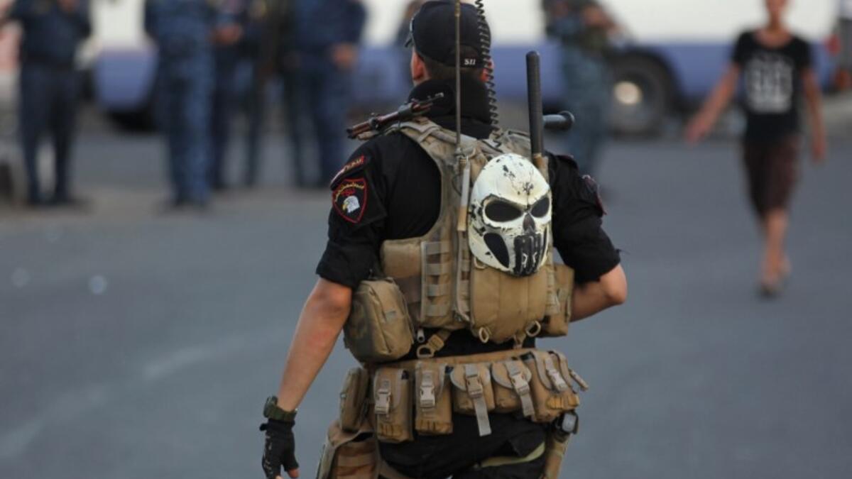 Members of the Iraqi security forces are deployed in the capital Baghdad's Tahrir Square during demonstrations against unemployment on July 16, 2018. (AFP/ Ahmad Al Rubaye)