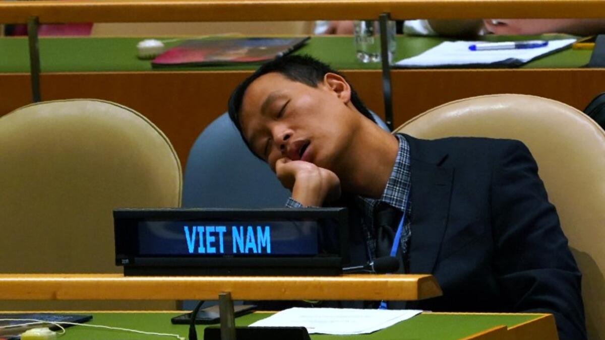 A member of Vietnamese delegation naps during the General Debate of the 73rd session of the General Assembly at the United Nations in New York September 25, 2018. 
Don EMMERT / AFP