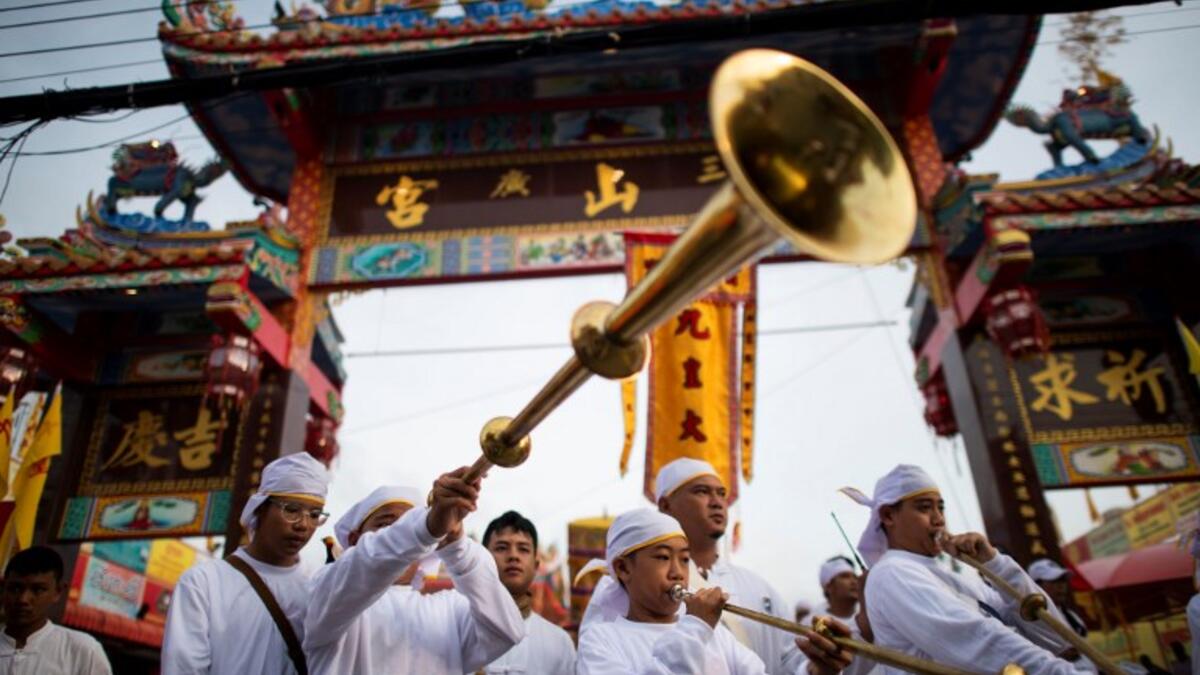 Devotees of the Loem Hu Thai Su shrine parade during the annual Vegetarian Festival in Phuket on October 12, 2018. Jewel SAMAD/AFP