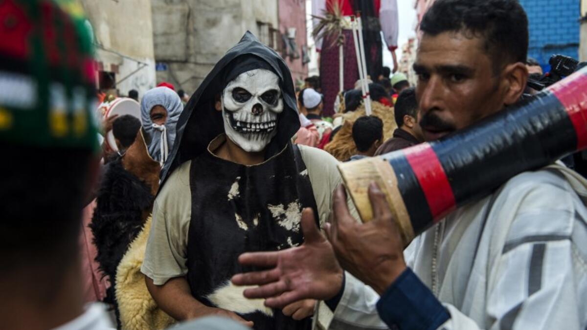 Young Moroccans take part in the Boujloud festival, a popular festival also known as the 'Moroccan Halloween' in the Sidi Moussa district of Sale near Rabat, on October 27, 2018. 
FADEL SENNA / AFP