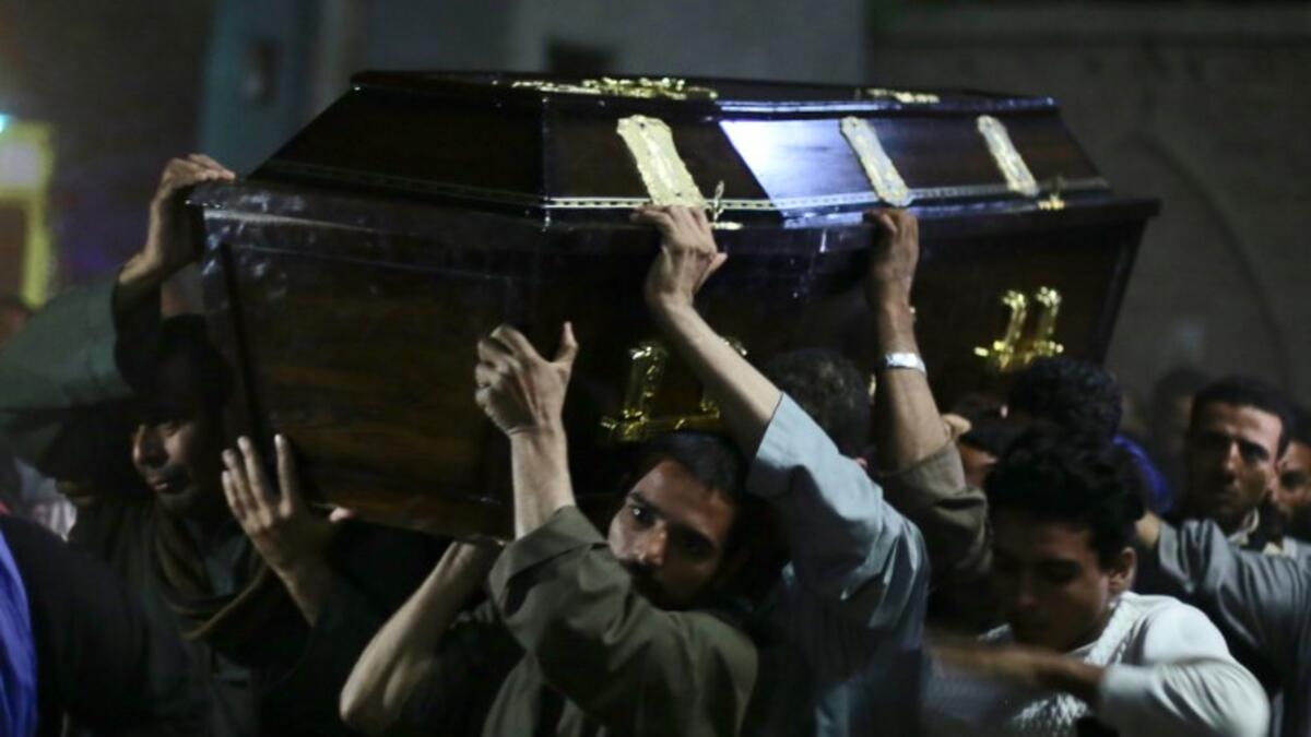 Egyptian relatives and friends of Christian Assad Labib, 35 year old, carry his casket during his funeral at the Anglican Church in Sawaada village near Minya city early on November 3, 2018. 
STR / AFP