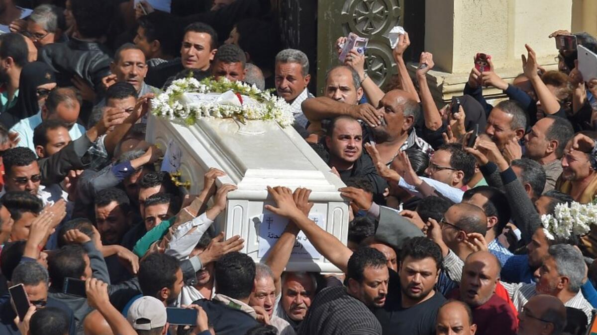Coptic Christians carry the coffins of victims killed in an attack a day earlier,following a morning ceremony at the Prince Tadros church in Egypt's southern Minya province, on November 3, 2018. 
MOHAMED EL-SHAHED / AFP