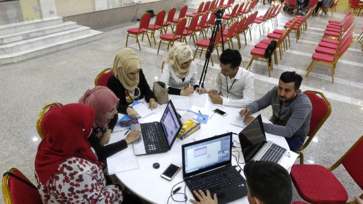 Iraqi youths work at "The Station", Baghdad's incubator for would-be entrepreneurs, in the Iraqi capital on November 17, 2018.
SABAH ARAR / AFP
