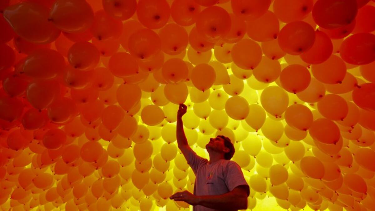 Thousands of biodegradable balloons are released by members of the Chamber of Commerce to celebrate New Year in Sao Paulo, Brazil, on December 28, 2017. 
Miguel SCHINCARIOL / AFP