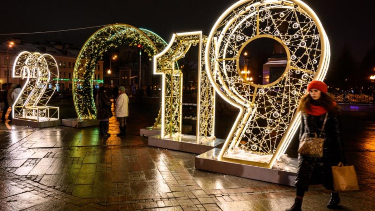 A woman walks in front of an illuminated "2019" sign on a square in central Moscow on December 30, 2018, ahead of the new year. 
Mladen ANTONOV / AFP