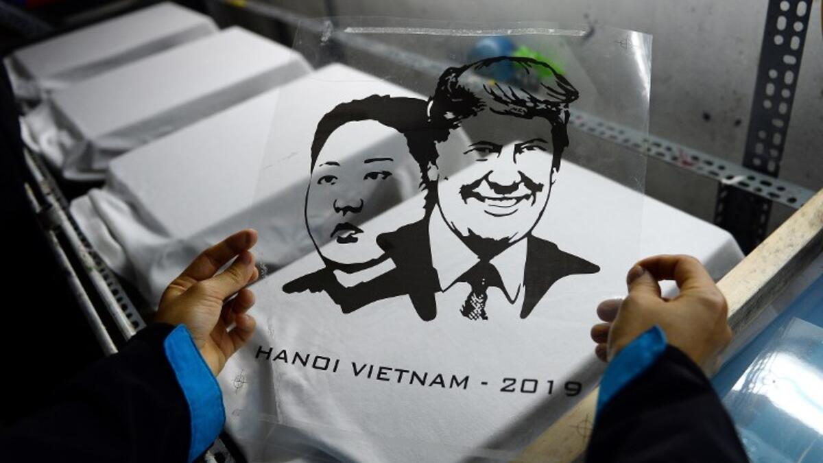 A Vietnamese worker prepares to print T-shirts with portraits of US President Donald Trump and North Korean leader Kim Jong Un at a workshop in Hanoi on February 22, 2019, ahead of the ahead of the second Trump and Kim summit. 
Nhac NGUYEN / AFP