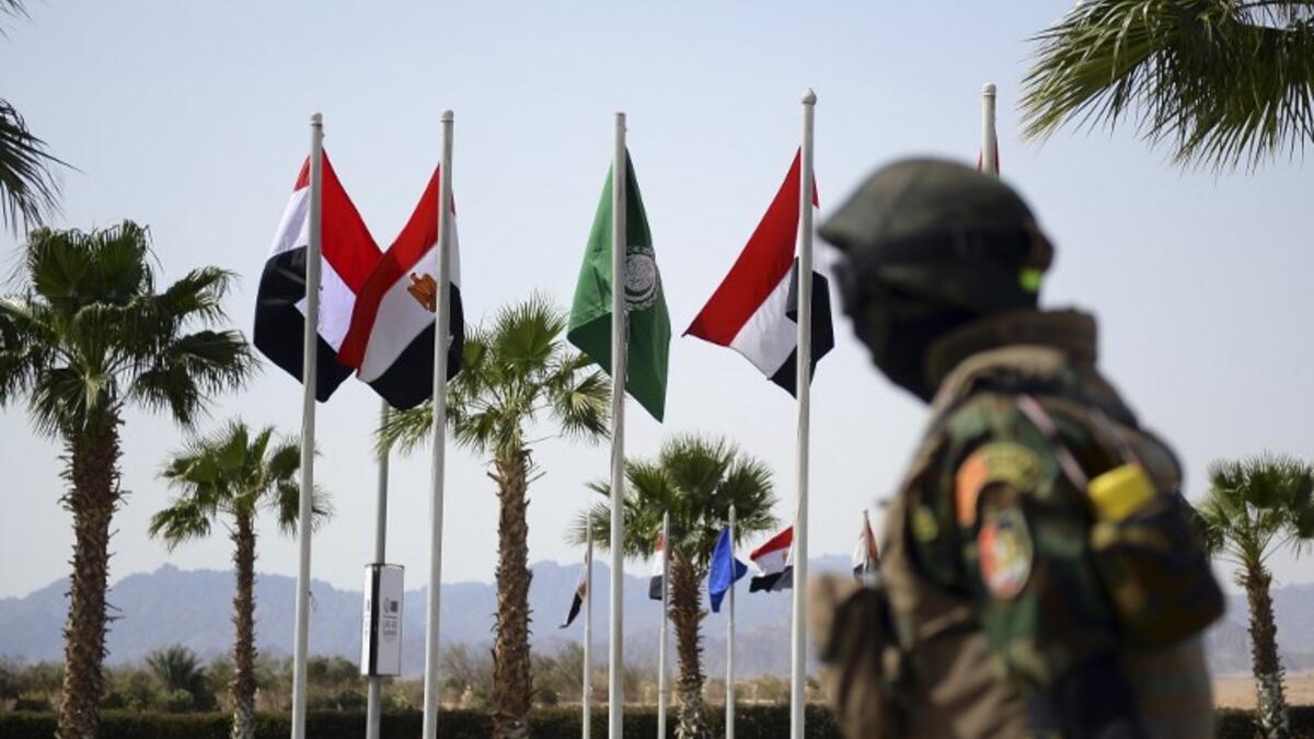 A member of the Egyptian Special Forces stands guard outside the International Congress Centre on February 24, 2019, ahead of first joint European Union and Arab League summit in the Egyptian Red Sea resort of Sharm el-Sheikh. 
Mohamed el-Shahed / AFP