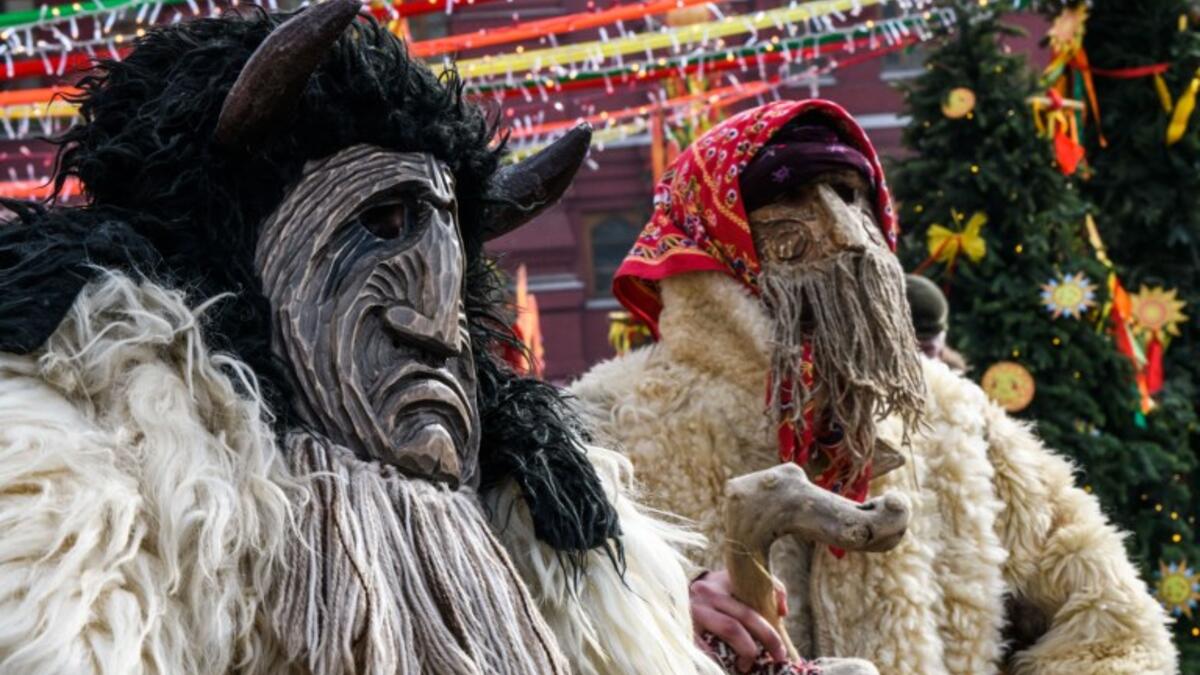 Performers in scary masks entertain the public during the Shrovetide spring festival outside the Kremlin in Moscow on March 01, 2019. 
Mladen ANTONOV / AFP