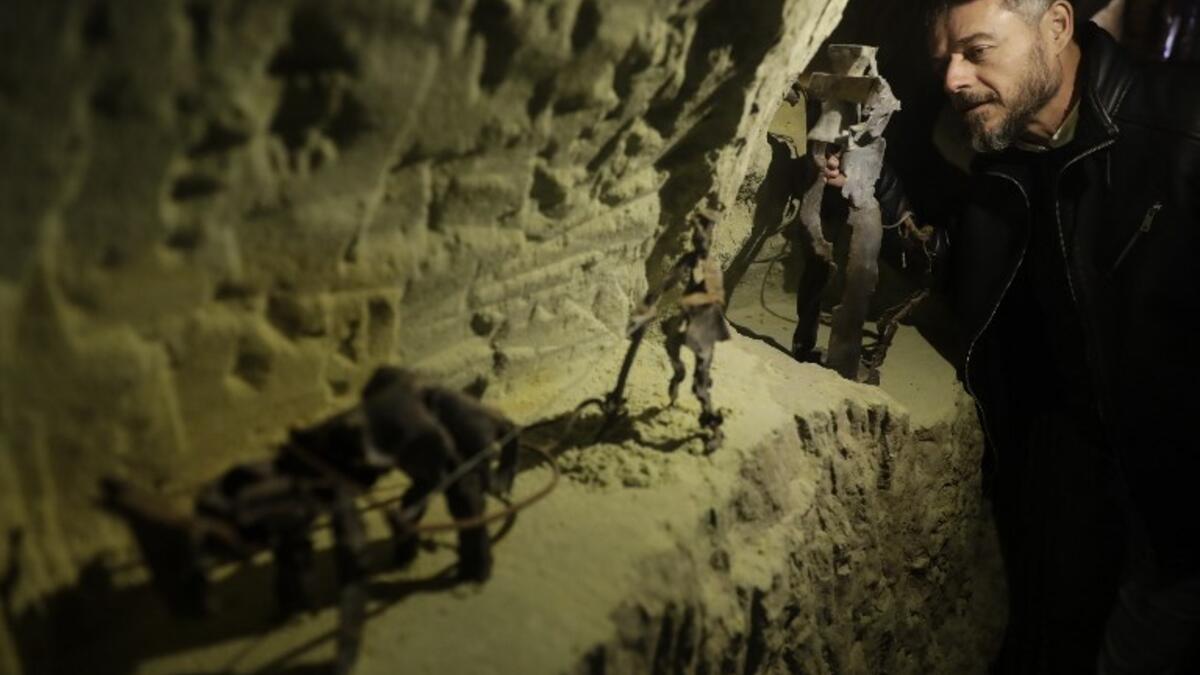 Lebanese Artist Charles Nassar inpsects of his sculptures made out of artillery shrapnels in the village of Remhala, south of Beirut, on March 7, 2019. 
JOSEPH EID / AFP