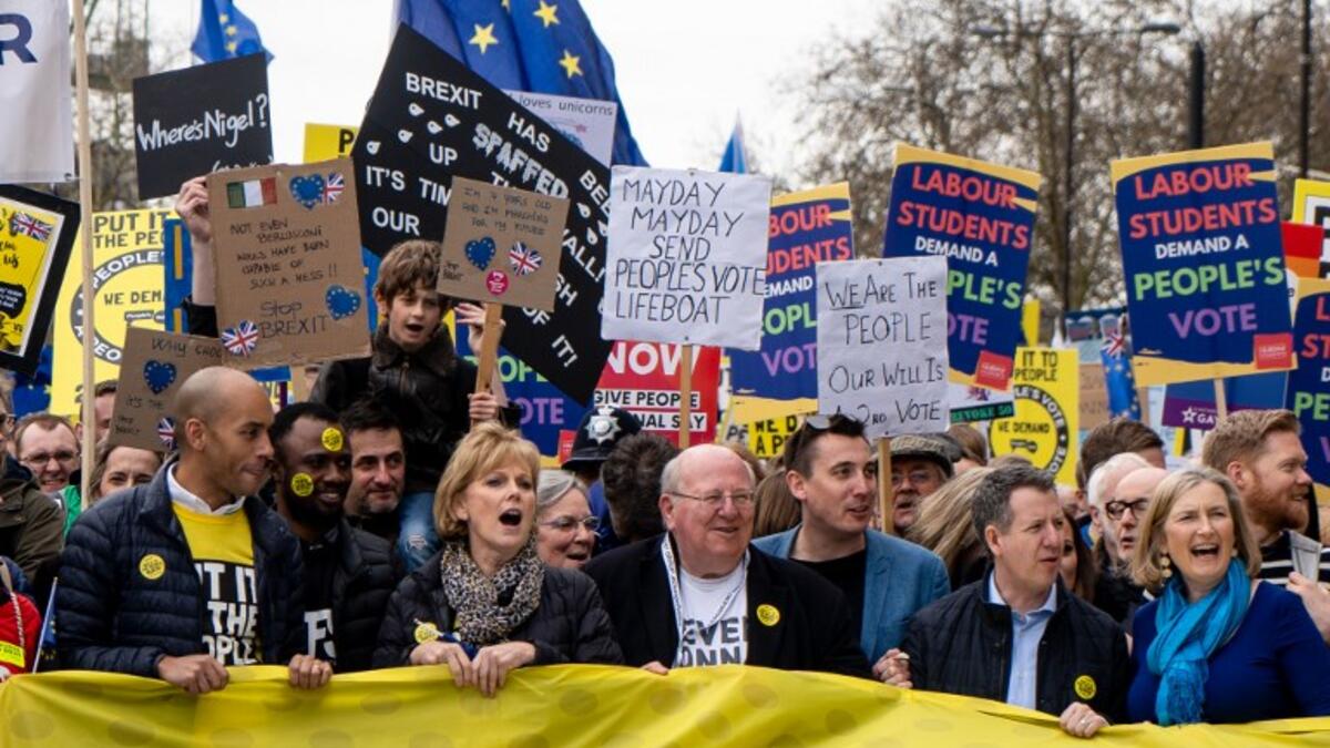 British parliamentarians and members of The Independent Group (L-R) Chuka Umunna, Anna Soubry, Mike Gapes, Gavin Shuker, Chris Leslie and Sarah Wollaston attend a march and rally organised by the pro-European People's Vote campaign for a second referendum in central London on March 23, 2019. 
Niklas HALLE'N / AFP
