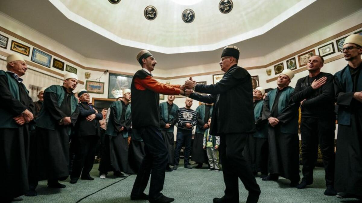 Kosovo Dervishes, adepts of Sufism, a mystical form of Islam, dance during a ceremony in a prayer room in Gjakova
Gent SHKULLAKU / AFP