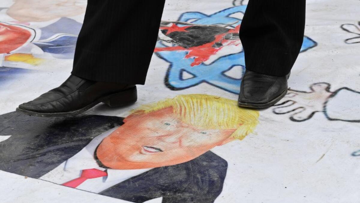 Syrians protest in the northern city of Aleppo against the US' decision to recognise Israel's sovereignty over the Golan Heights on March 26, 2019. 
George OURFALIAN / AFP