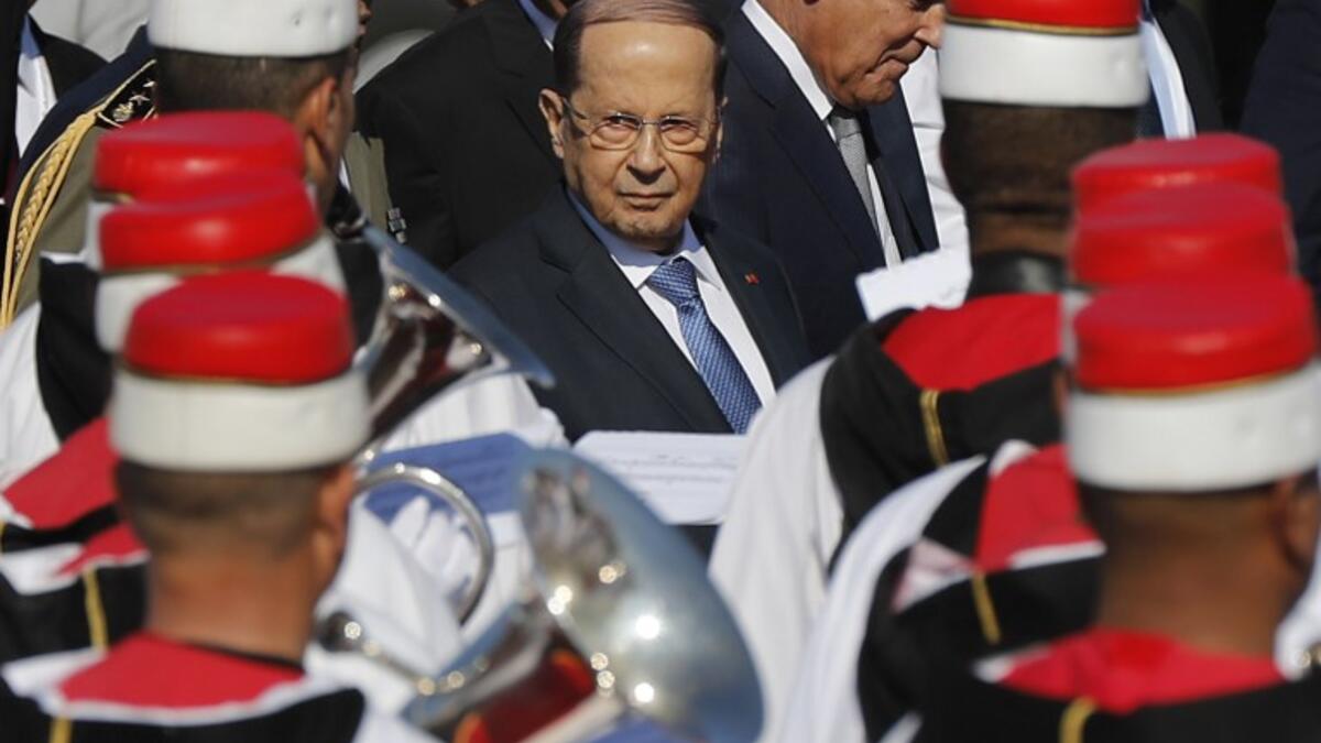 Lebanese President Michel Aoun reviews the honour guard upon his arrival at Tunis-Carthage international airport on March 30, 2019, to attend the Arab Summit tomorrow. 
Hussein Malla / POOL / AFP