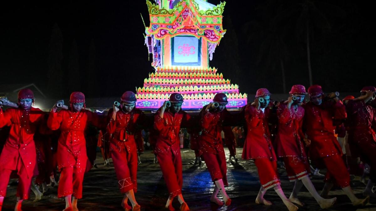 Traditional dancers perform during abbot Kay Lar Tha's funeral procession in Mudon, Mon State. 
Ye Aung THU / AFP