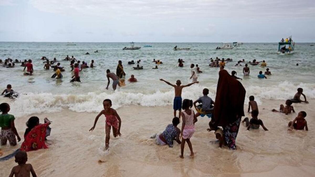 Muslims are pictured at Bamburi Public beach in the coastal city of Mombasa, Kenya on August 9, 2013. (AFP)