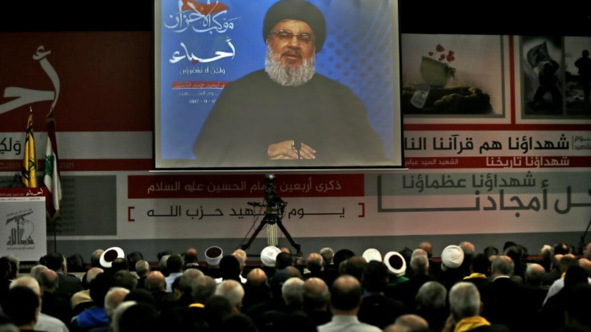 A picture taken on Nov. 10, 2017, shows Hassan Nasrallah, the head of Lebanon's militant Shiite movement Hezbollah, giving a televised address during a gathering in Beirut's southern suburb. 

Nasrallah said Saad Hariri, who resigned as Lebanese prime minister from Riyadh last week, was "detained" by Saudi Arabia.

(ANWAR AMRO / AFP)