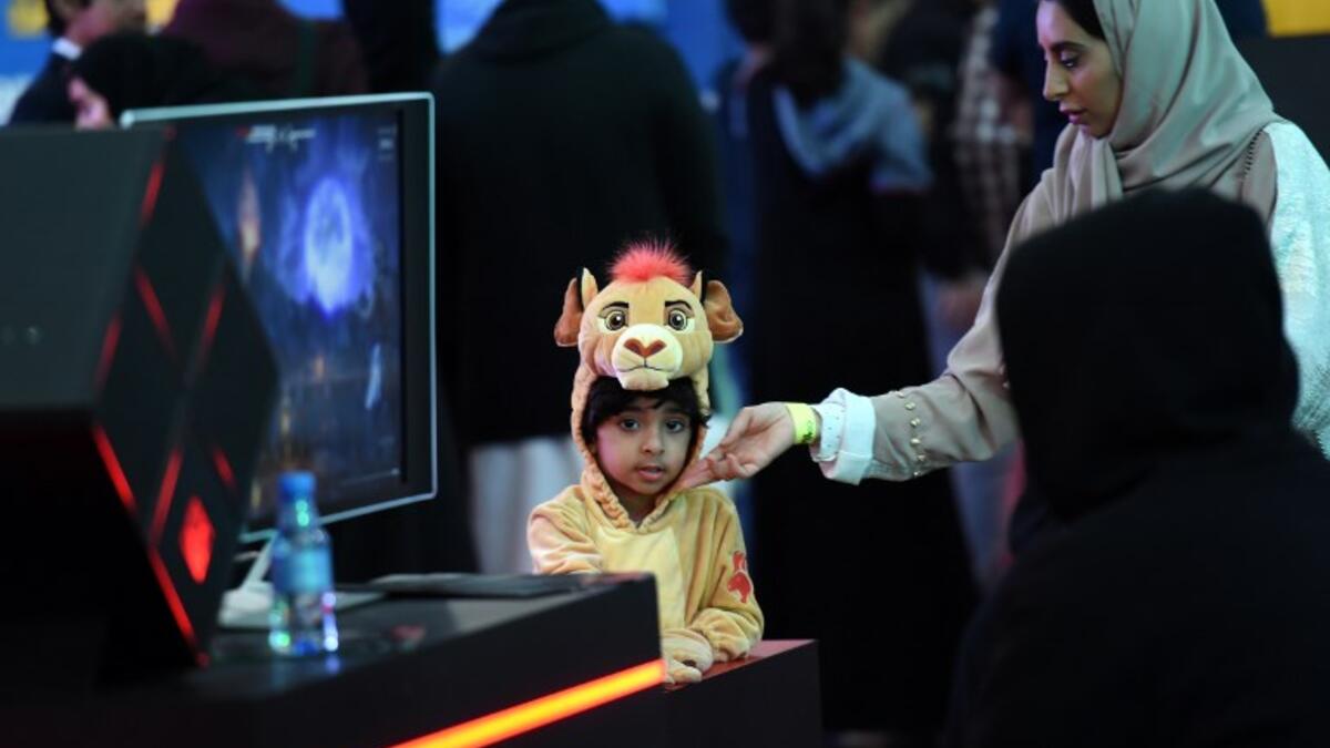 A Saudi child dressed as Simba from Disney's 1994 animated "The Lion King" film attends the first ever Comic-Con Arabia event held in the capital Riyadh on November 25, 2017. 
(FAYEZ NURELDINE / AFP)