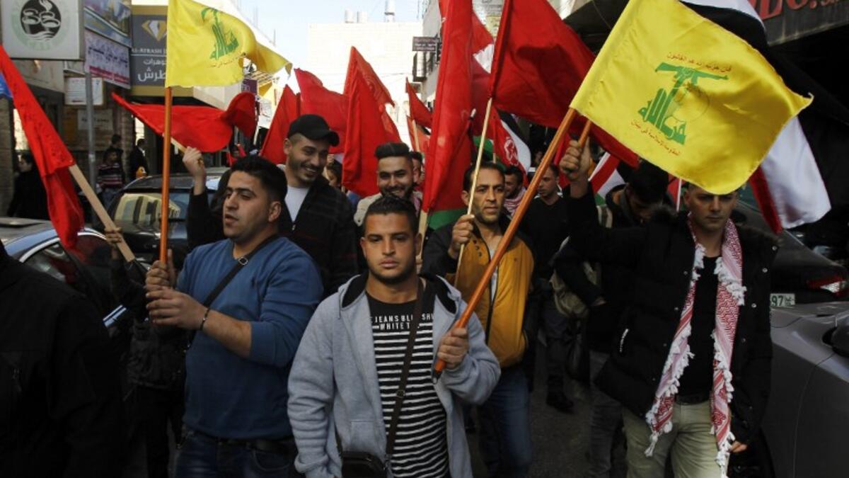 Supporters of the Popular Front for the Liberation of Palestine (PFLP) take part in a demonstration in Bethlehem in the Israeli occupied West Bank, as protests continue in the region amid anger over the U.S. president's recognition of Jerusalem as Israel's capital. 
Musa AL SHAER / AFP