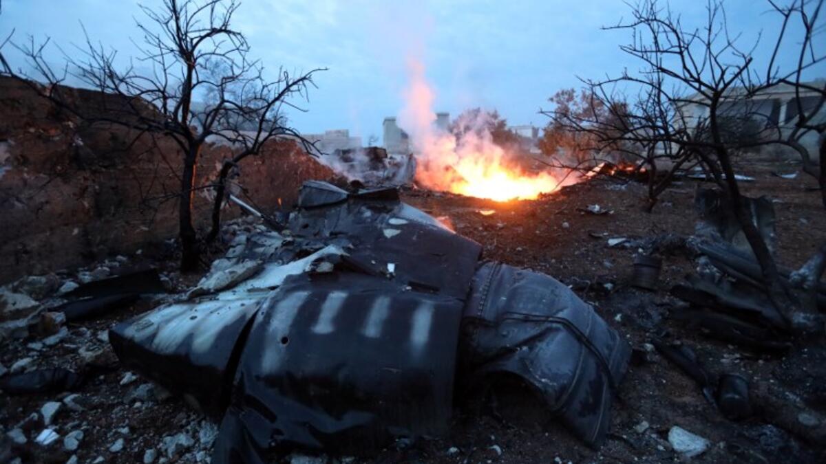 A picture taken on Feb. 3, 2018, shows smoke billowing from the site of a downed Sukhoi-25 fighter jet in Syria's northwest province of Idlib. Rebel fighters shot down a Russian plane over Syria's northwest Idlib province and captured its pilot, the Syrian Observatory for Human Rights said. (OMAR HAJ KADOUR / AFP)