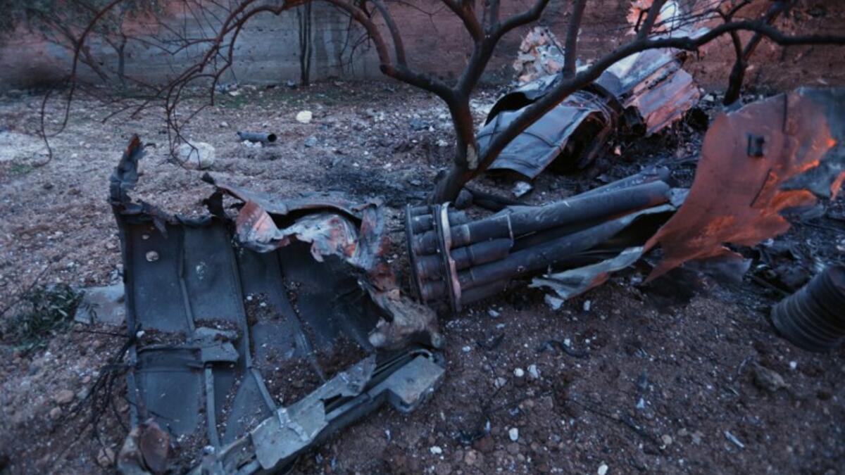 A picture taken on Feb. 3, 2018, shows parts of a downed Sukhoi-25 fighter jet in Syria's northwest province of Idlib. Rebel fighters shot down a Russian plane over Syria's northwest Idlib province and captured its pilot, the Syrian Observatory for Human Rights said. (OMAR HAJ KADOUR / AFP)
