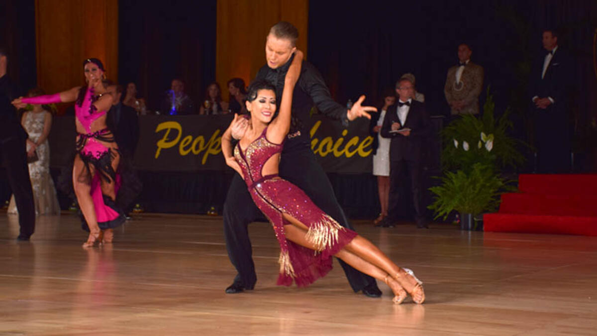 American Rhythm refers to a category of dances in American Style Ballroom competitions. This division includes dances known as the Cha-Cha, Rumba, East Coast Swing, Bolero, and Mambo. (wikidancesport.com)