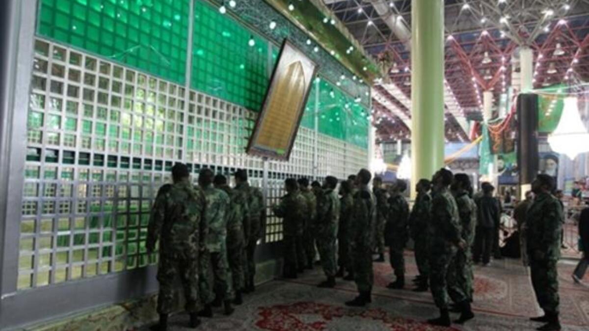 Iranian soldiers visit the shrine of Ayatollah Ruhollah Khomeini.