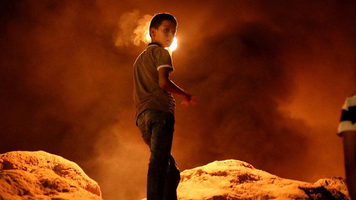 A Palestinian protester from a group calling themselves the "night confusion units"  (ipnotglobal/Fadi Thabet)