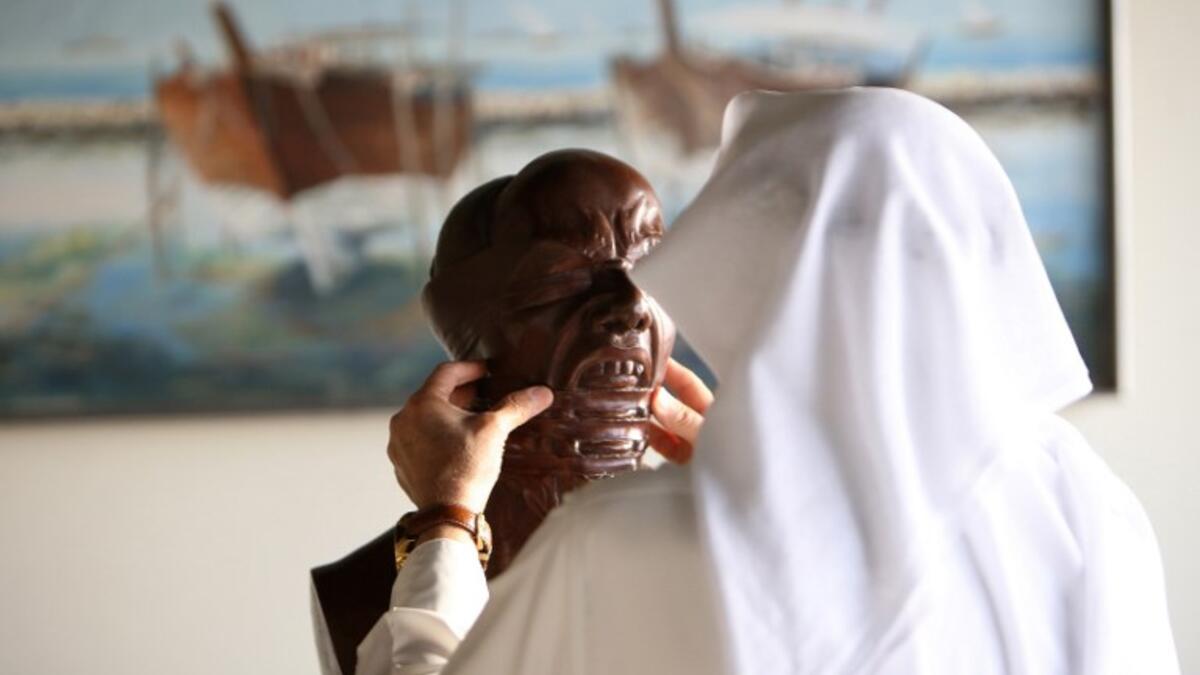 Kuwaiti sculptor Sami Mohammed poses with one of his works at the Museum of Modern Art in Kuwait City on October 4, 2018. 
Yasser Al-Zayyat / AFP