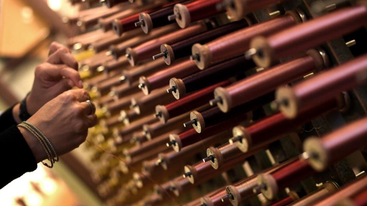 This picture  shows a close-up view of reels of thread in the laboratory of Antico setificio Fiorentino ancient silk factory in Florence. 
Tiziana FABI / AFP