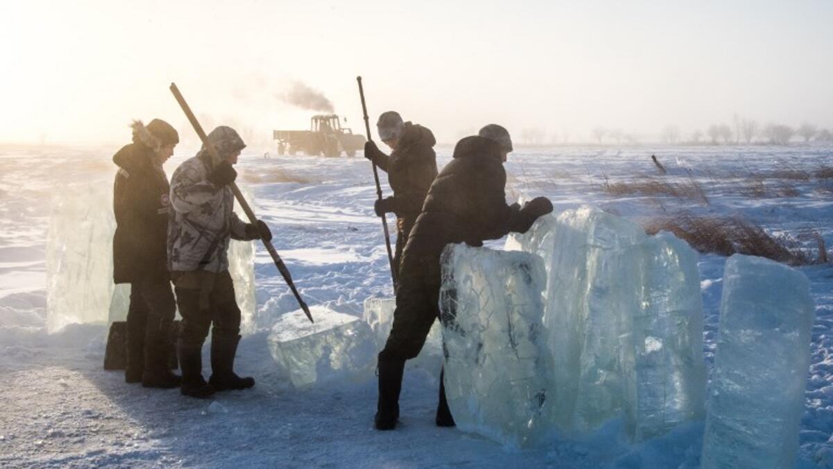 Villagers harvest ice from a local lake near the settlement of Oy, some 70 km south of Yakutsk, with the air temperature at about minus 41 degrees Celsius.
Mladen ANTONOV / AFP