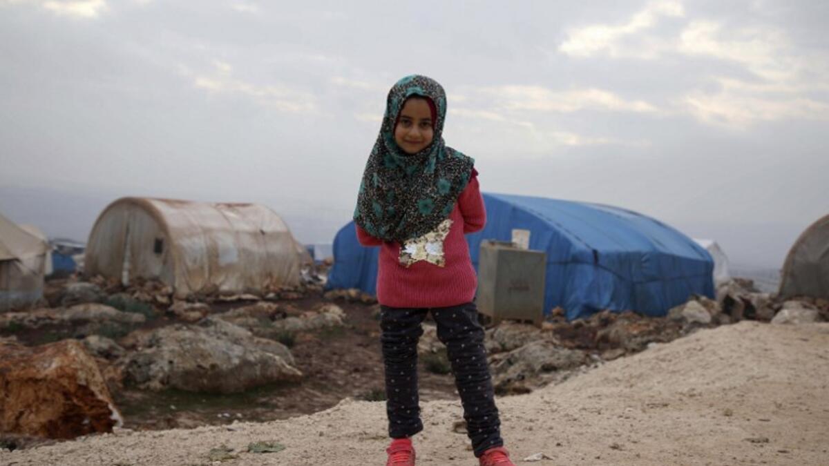 Syrian Maya Merhi poses for a picture in the Internally Displaced Persons (IDP) camp of Serjilla in northwestern Syria next to Bab al-Hawa border crossing with Turkey.
Aaref WATAD / AFP