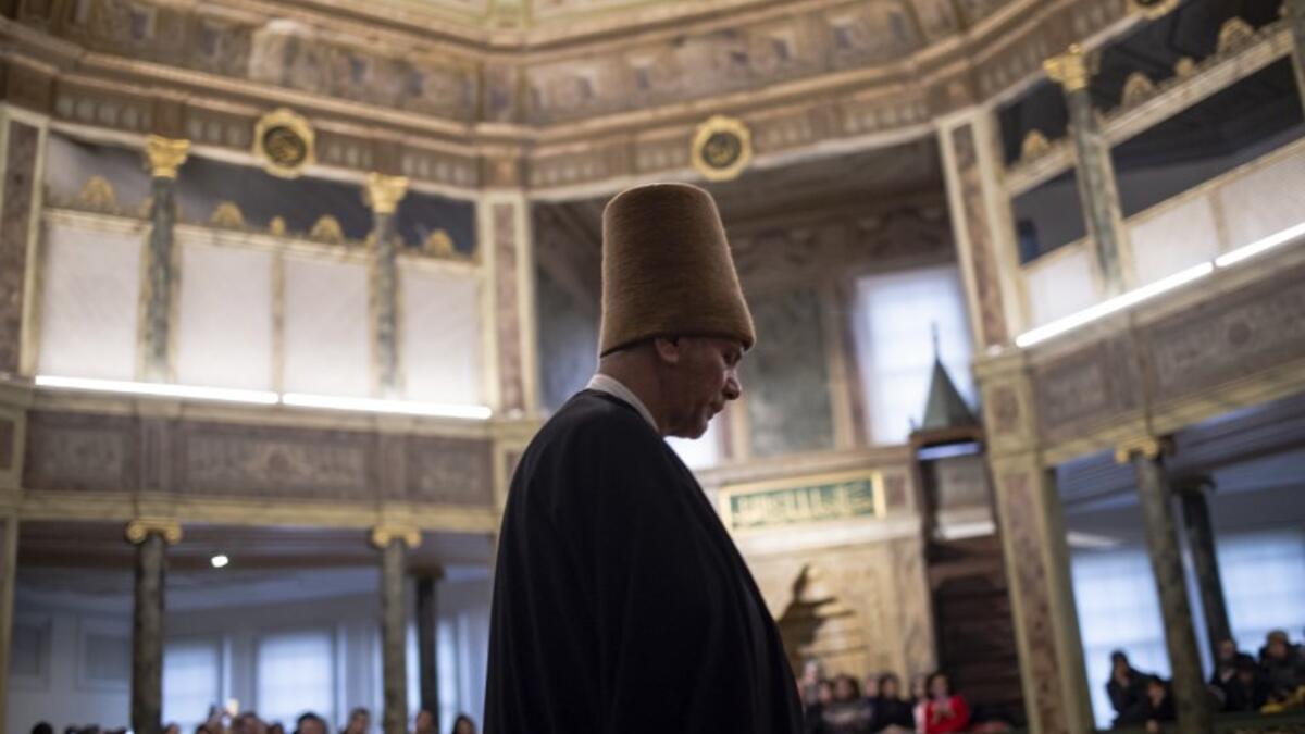 Whirling dervishes perform during a ceremony marking the anniversary of the death of Jelaleddin Mevlana Rumi, Sufi mystic, poet and founder of the sufism on December 16, 2018 at Galata Mevlihanesi in Istanbul. 
Yasin AKGUL / AFP