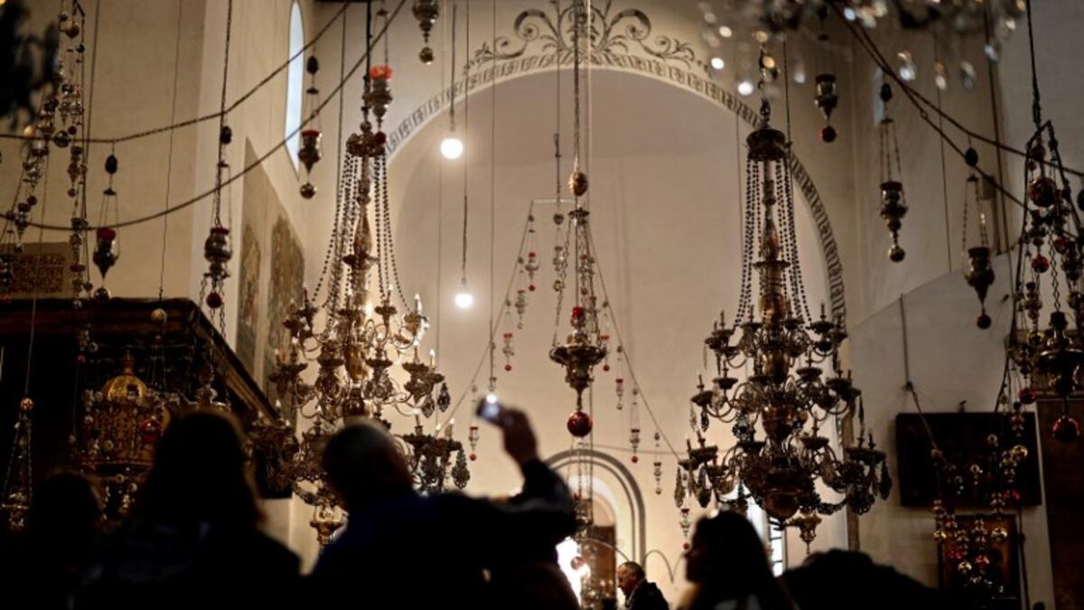 Tourists and pilgrims visit the Church of the Nativity in the Biblical West Bank city of Bethlehem, on December 22, 2018, three days ahead of the Christmas celebration. Thomas Coex/AFP