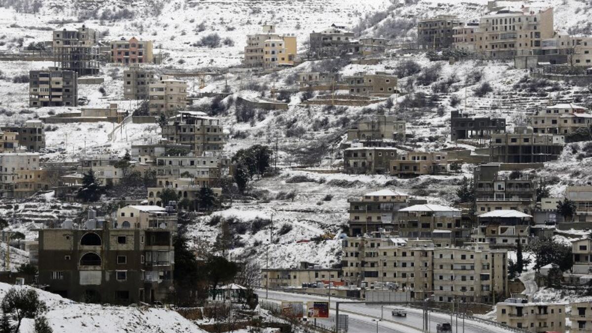 Village of Sofar, some 30 kilometres (20 miles) east of the Lebanese capital Beirut on January 7, 2019, shows a neighbouring village covered in snow as a fierce winter storm lashed the east coast of the Mediterranean. 
JOSEPH EID / AFP
