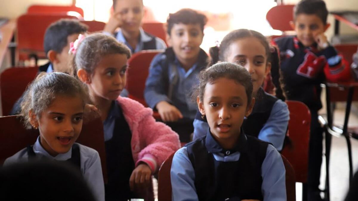 Children attend a music class at the Al-Nawras school in Taez, Yemen's third city, in the country's southwest
AHMAD AL-BASHA / AFP