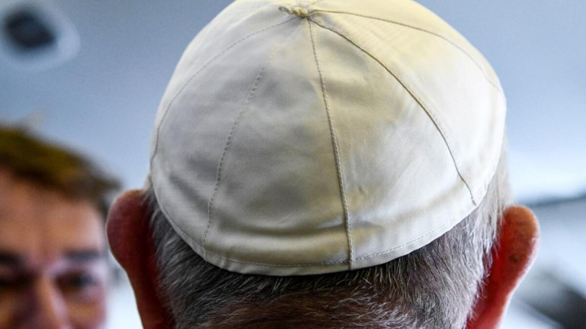 Pope Francis arrives to speak to reporters aboard a plane on his way to Abu Dhabi on February 3, 2019. 
Vincenzo PINTO / AFP